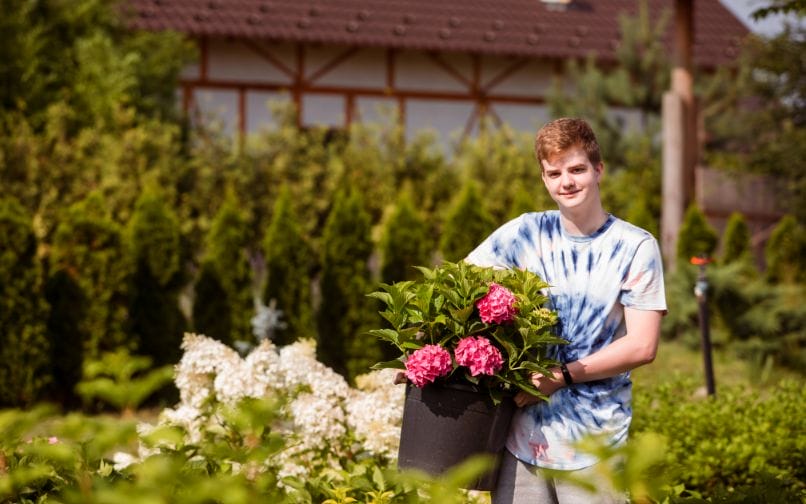 Student holding flowers